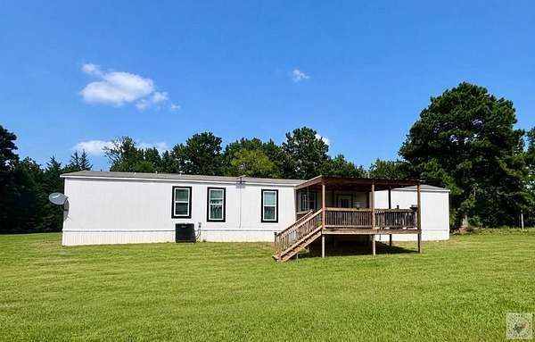 25.1 Acres of Agricultural Land with Home for Sale in Atlanta, Texas