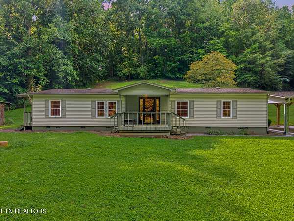 7.68 Acres of Land with Home for Sale in Friendsville, Tennessee