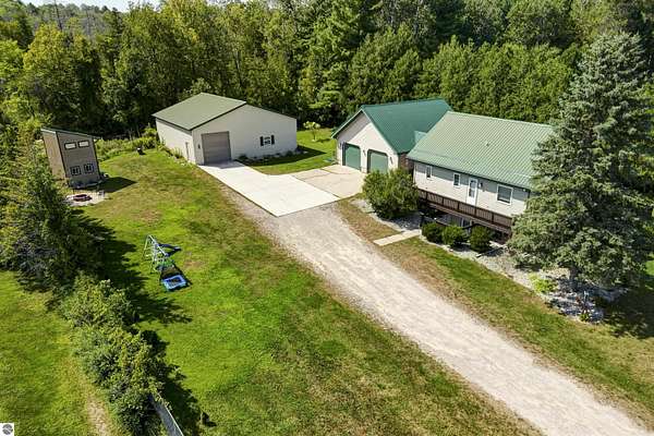 1.5 Acres of Land with Home for Sale in Cedar, Michigan