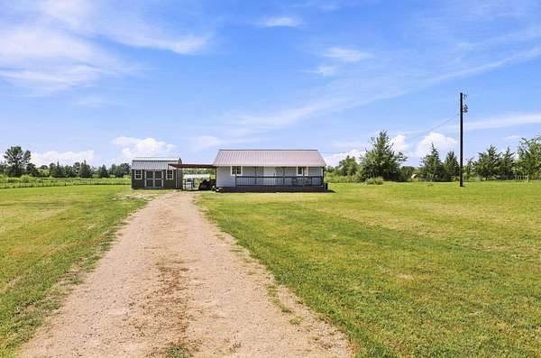 2 Acres of Land with Home for Sale in Deport, Texas