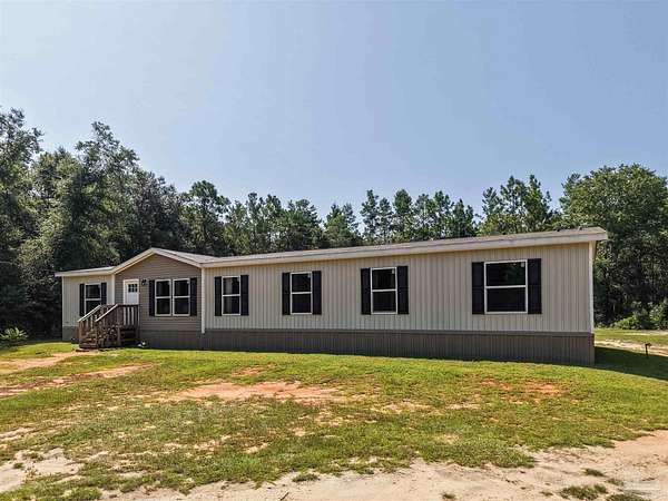 5.54 Acres of Land with Home for Sale in Milton, Florida