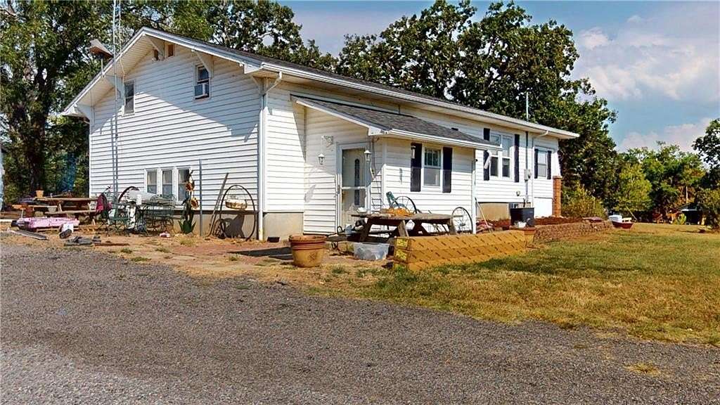 5 Acres of Land with Home for Auction in Nevada, Missouri