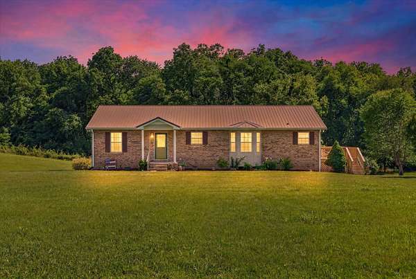 1.63 Acres of Land with Home for Sale in Cedar Hill, Tennessee