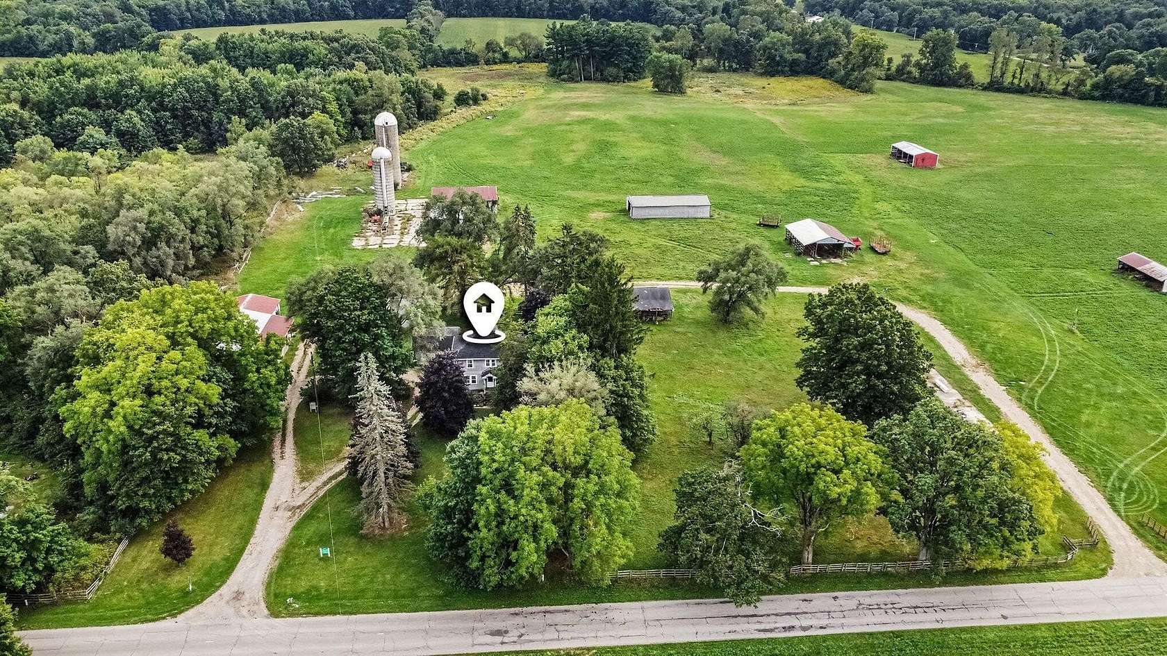 82.7 Acres of Agricultural Land with Home for Sale in Rives Junction, Michigan