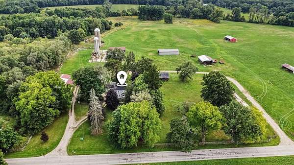 82.7 Acres of Agricultural Land with Home for Sale in Rives Junction, Michigan