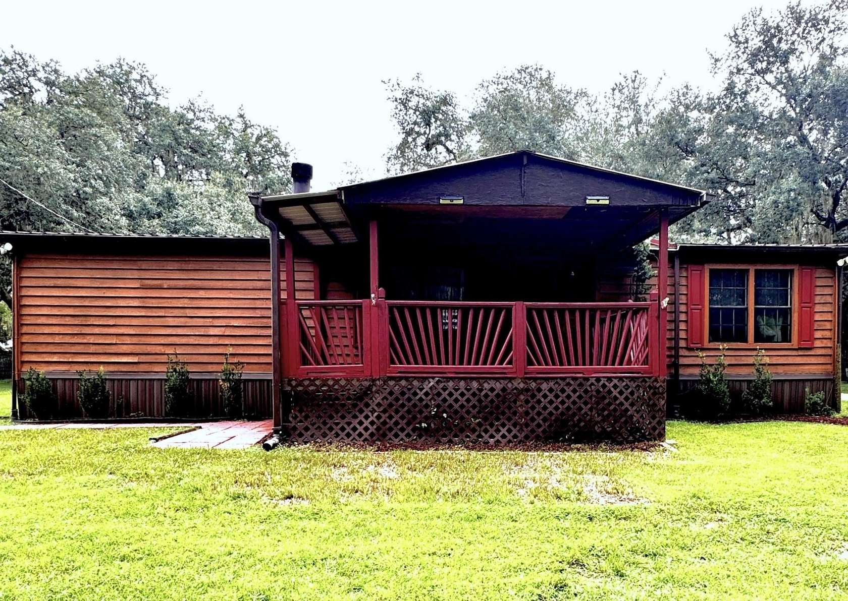 1.57 Acres of Land with Home for Sale in Florahome, Florida