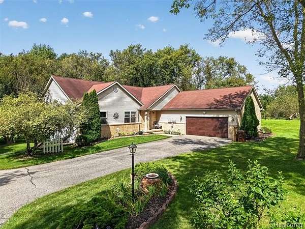 2 Acres of Land with Home for Sale in Marion Township, Michigan
