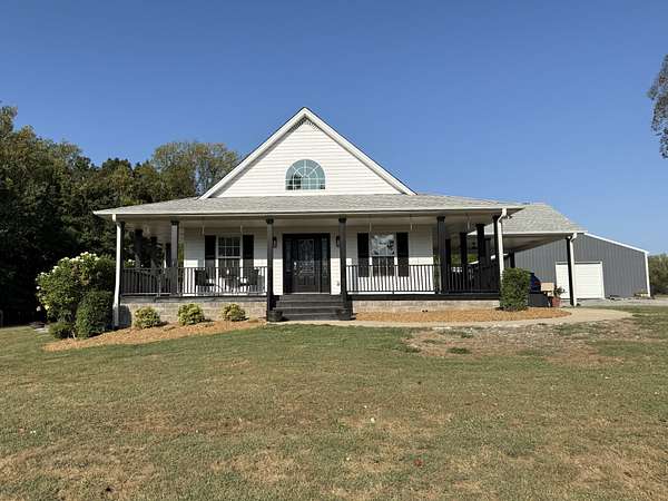 7.32 Acres of Land with Home for Sale in Cottontown, Tennessee