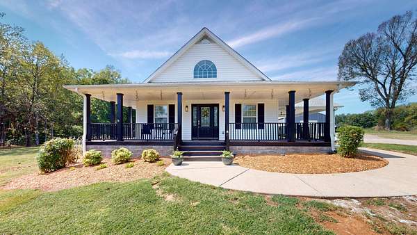7.32 Acres of Land with Home for Sale in Cottontown, Tennessee