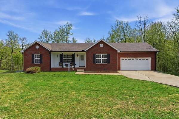 5 Acres of Land with Home for Sale in Charlotte, Tennessee