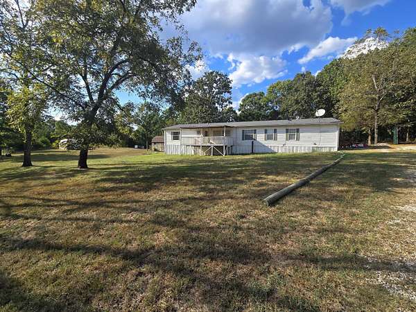 28 Acres of Land with Home for Sale in Peace Valley, Missouri