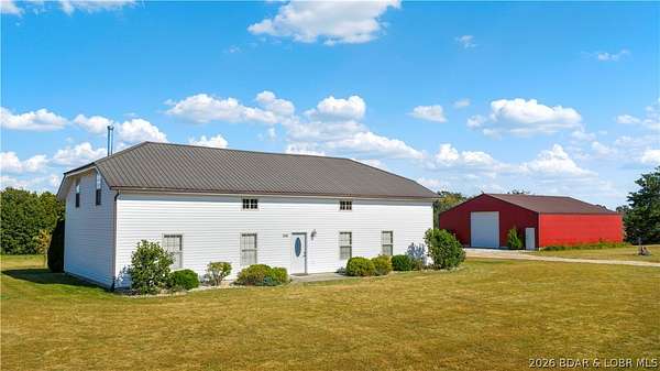 26.7 Acres of Recreational Land with Home for Sale in Macks Creek, Missouri