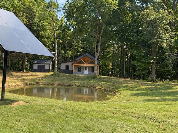 57.7 Acres of Land with Home for Sale in Summer Shade, Kentucky