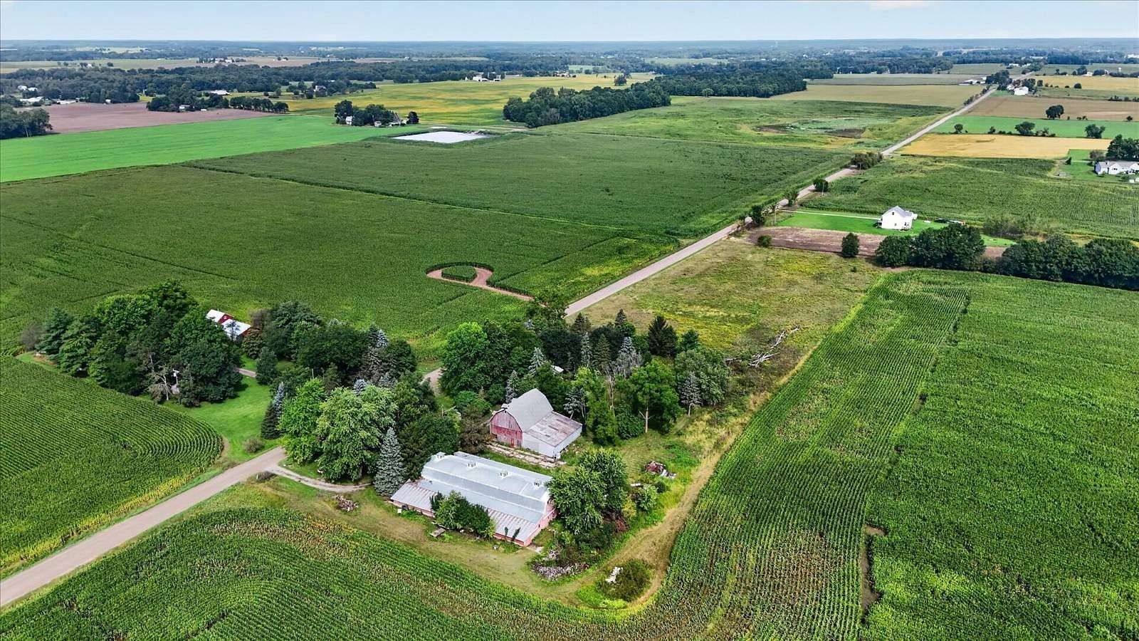 7.7 Acres of Land with Home for Auction in Webberville, Michigan