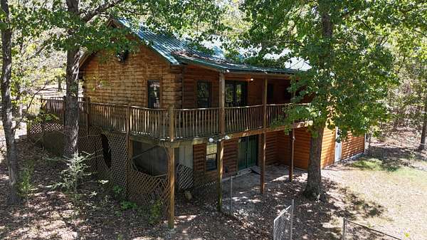 7 Acres of Land with Home for Sale in Lampe, Missouri