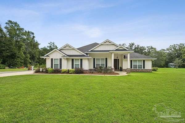 1.77 Acres of Land with Home for Sale in Pace, Florida