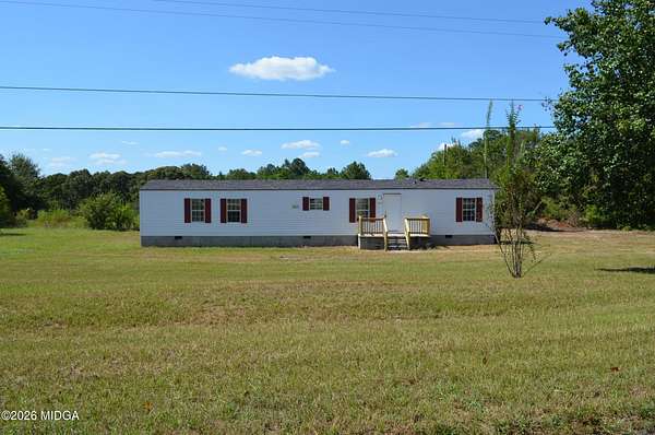 1.5 Acres of Land with Home for Sale in Byron, Georgia