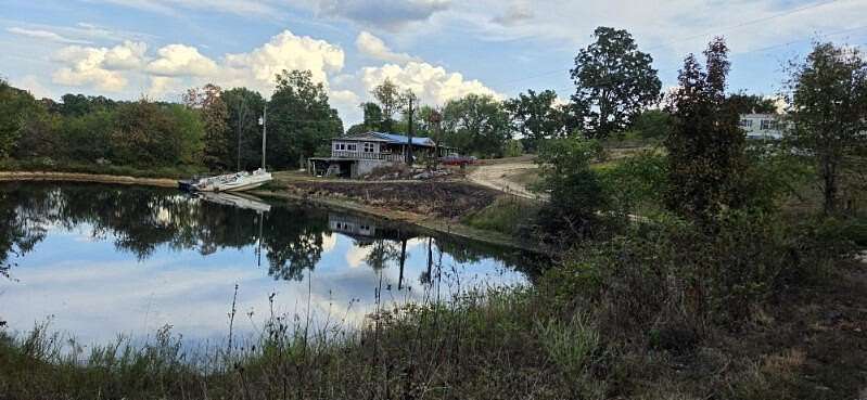 157 Acres of Land with Home for Sale in Grovespring, Missouri
