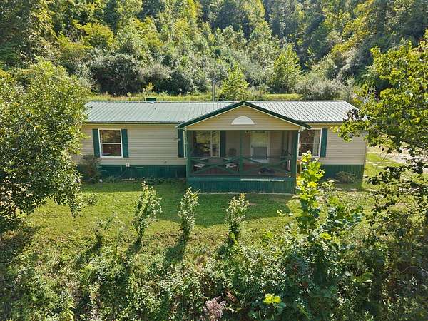 7 Acres of Land with Home for Sale in Oil Springs, Kentucky