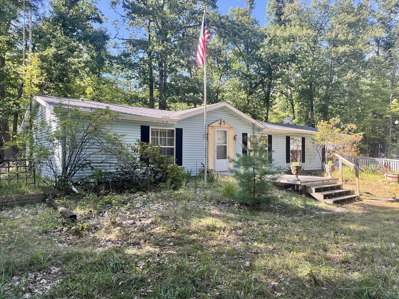 10 Acres of Recreational Land with Home for Sale in Comins, Michigan