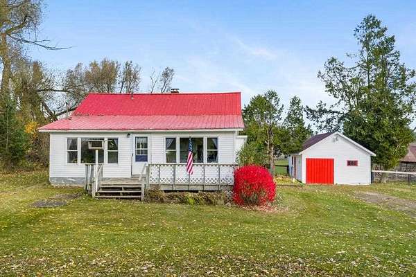 13 Acres of Land with Home for Sale in Brutus, Michigan