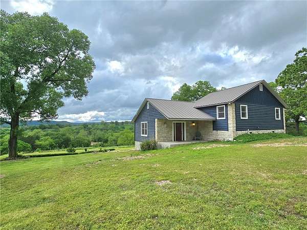 6.26 Acres of Land with Home for Sale in Berryville, Arkansas