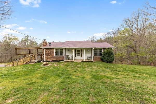 7.37 Acres of Land with Home for Sale in Vanleer, Tennessee