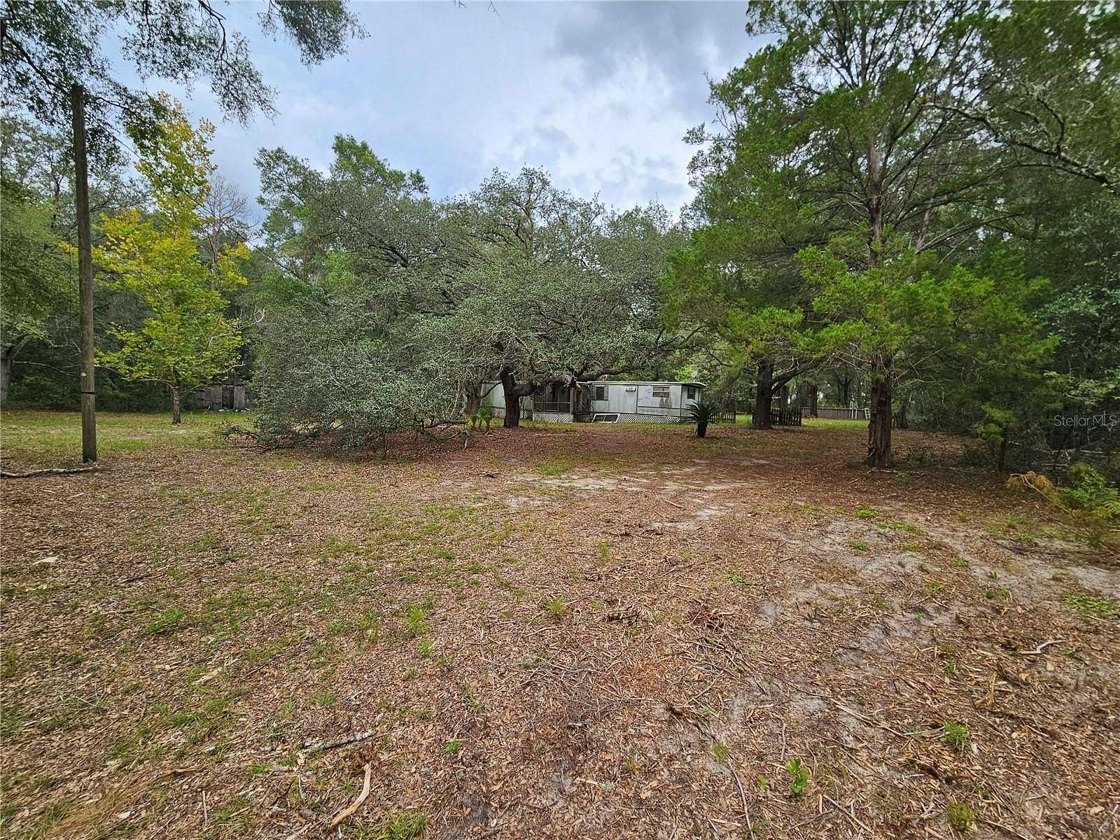 2.5 Acres of Land with Home for Sale in Bronson, Florida