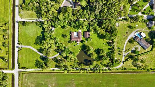 4.7 Acres of Land with Home for Sale in Loxahatchee Groves, Florida