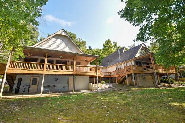 6.8 Acres of Land with Home for Sale in Rockaway Beach, Missouri