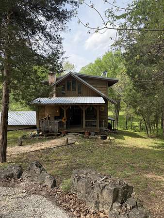 10 Acres of Land with Home for Sale in Walnut Shade, Missouri