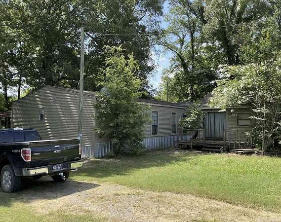 3.9 Acres of Land with Home for Auction in Humphrey, Arkansas