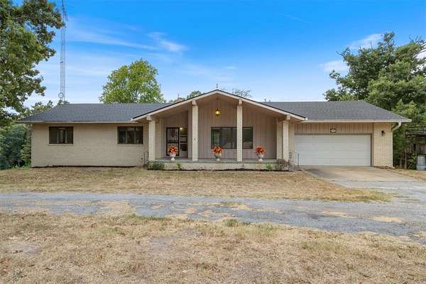 6.67 Acres of Land with Home for Sale in Gravette, Arkansas