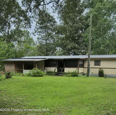 2.5 Acres of Land with Home for Sale in Spring Hill, Florida