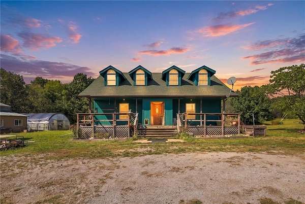 40 Acres of Land with Home for Sale in Archie, Missouri