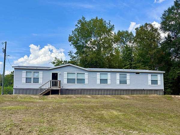 4.69 Acres of Land with Home for Sale in De Berry, Texas