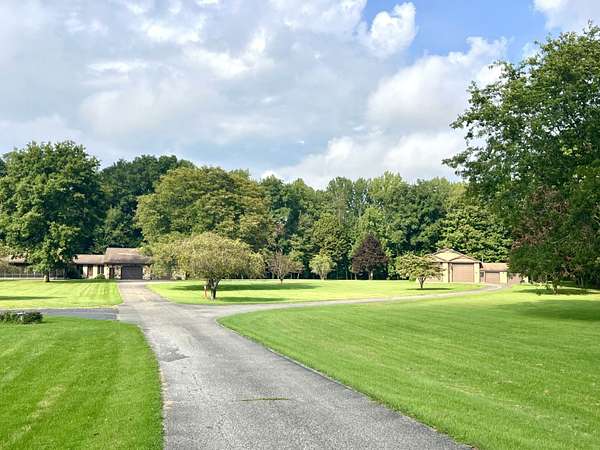 10 Acres of Recreational Land with Home for Sale in Girard, Pennsylvania