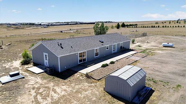 35 Acres of Agricultural Land with Home for Sale in Keenesburg, Colorado