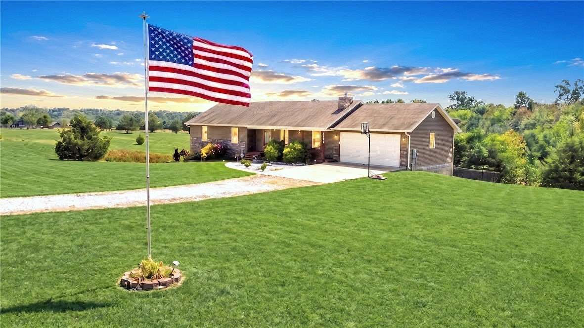 5.1 Acres of Land with Home for Sale in Gravette, Arkansas