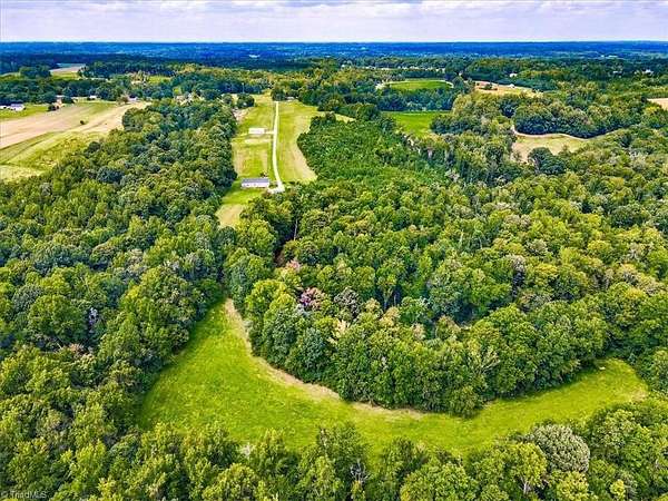 45.6 Acres of Land with Home for Sale in Gibsonville, North Carolina