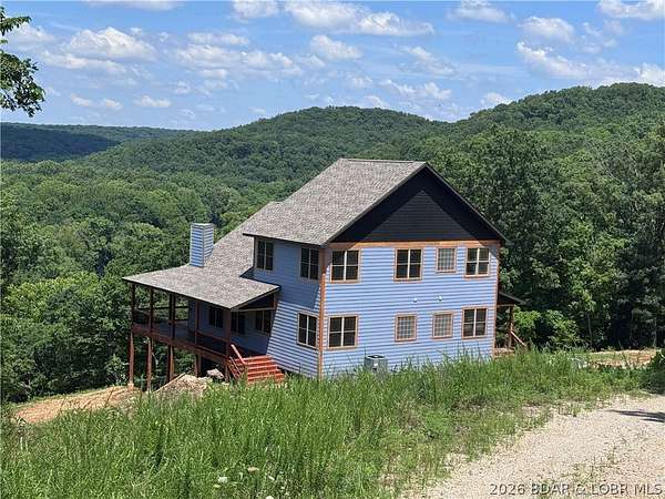9.66 Acres of Land with Home for Sale in Roach, Missouri