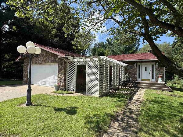 5.2 Acres of Land with Home for Auction in Bristol, Indiana