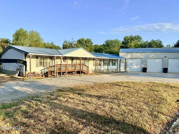 77.1 Acres of Land with Home for Sale in Asbury, Missouri