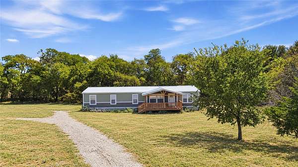 2.5 Acres of Land with Home for Sale in Commerce, Texas