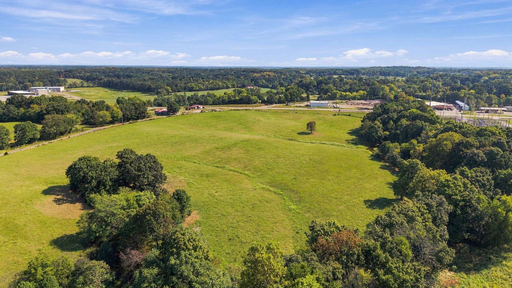 24.7 Acres of Commercial Land for Sale in Bon Aqua, Tennessee