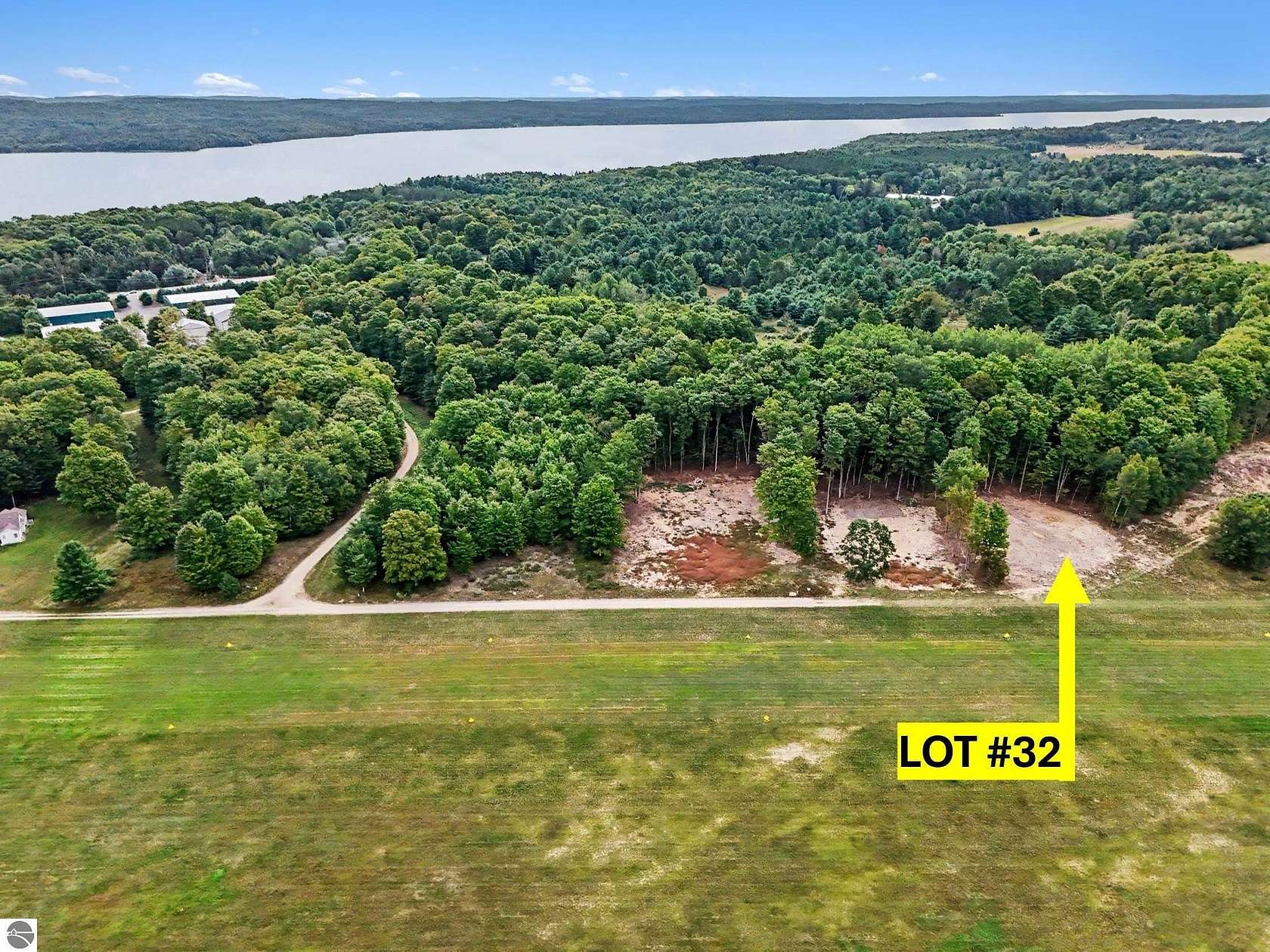 0.83 Acres of Residential Land for Sale in Kewadin, Michigan