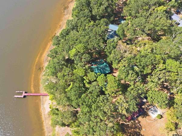1.79 Acres of Land with Home for Sale in Scroggins, Texas