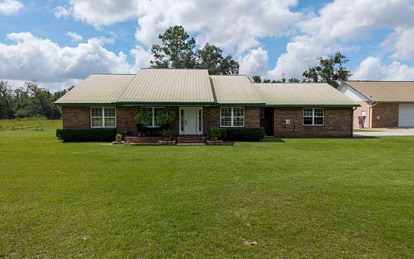 18.4 Acres of Land with Home for Sale in McAlpin, Florida