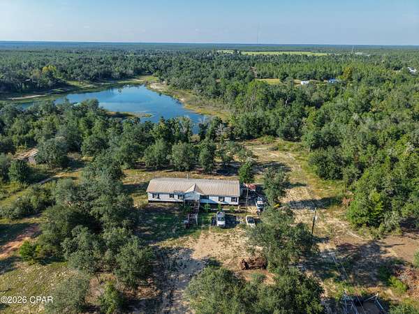 2.5 Acres of Land with Home for Sale in Fountain, Florida