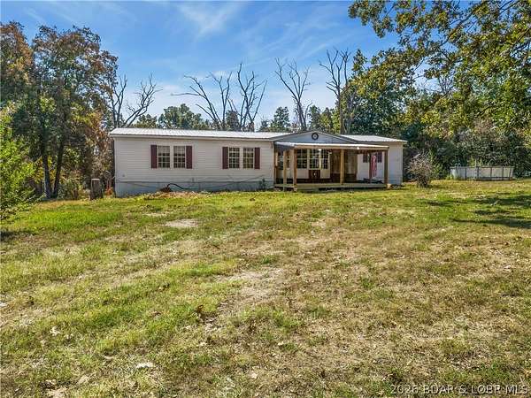 18.7 Acres of Land with Home for Sale in Macks Creek, Missouri
